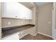 Built-in desk area features upper and lower cabinets, and great countertop space at 1768 E Grand Ridge Rd, Queen Creek, AZ 85140