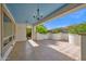 Expansive covered patio with stylish chandeliers offers a perfect blend of indoor-outdoor living at 1768 E Grand Ridge Rd, Queen Creek, AZ 85140