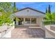 A covered patio with tiled flooring offers a great space for outdoor relaxation and entertaining at 1768 E Grand Ridge Rd, Queen Creek, AZ 85140