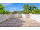Spacious outdoor patio with decorative tiled flooring, offering a serene setting for relaxation and entertainment at 1768 E Grand Ridge Rd, Queen Creek, AZ 85140