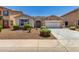 Charming single-story home with a stone accent facade, low-maintenance landscaping, and a two-car garage at 18041 W Ivy Ln, Surprise, AZ 85388