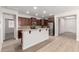 Modern kitchen features stainless steel appliances, granite countertops, and an eat-in breakfast bar at 18041 W Ivy Ln, Surprise, AZ 85388