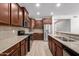 Well-equipped kitchen features granite countertops, stainless appliances, and ample cabinet space at 18041 W Ivy Ln, Surprise, AZ 85388