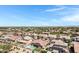 Aerial shot of neighborhood featuring lush landscaping and backyard pools at 19009 E Reins Rd, Queen Creek, AZ 85142