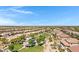 Community aerial view featuring a park, playground, and residential homes at 19009 E Reins Rd, Queen Creek, AZ 85142