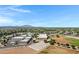 Neighborhood aerial showcasing the school in a well-planned residential area at 19009 E Reins Rd, Queen Creek, AZ 85142