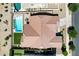 Aerial view showcasing pool, lush landscaping, and patio at 19009 E Reins Rd, Queen Creek, AZ 85142