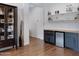 Built in bar area features mini fridge and shelving for storage and display at 19009 E Reins Rd, Queen Creek, AZ 85142