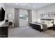 Spacious Primary bedroom with carpet, natural light, ceiling fan and walk-in closet at 19009 E Reins Rd, Queen Creek, AZ 85142
