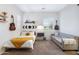 Bedroom featuring cozy bed and couch with neutral colors and stylish decor at 19009 E Reins Rd, Queen Creek, AZ 85142