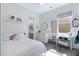 Bright bedroom with white walls, a large window, and a view into the Primary bathroom at 19009 E Reins Rd, Queen Creek, AZ 85142