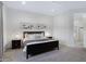 Bright Primary bedroom with ceiling fan, carpet, and contemporary decor at 19009 E Reins Rd, Queen Creek, AZ 85142
