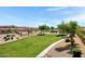 Well-maintained community park with playground and green space at 19009 E Reins Rd, Queen Creek, AZ 85142