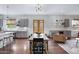 Open-concept kitchen and dining area with hardwood floors, modern lighting, and access to the living space at 19009 E Reins Rd, Queen Creek, AZ 85142