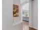 Bright hallway view leading to a modern kitchen with light gray cabinets at 19009 E Reins Rd, Queen Creek, AZ 85142