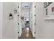 Hallway with wood floors and decor leading to bedrooms and other rooms at 19009 E Reins Rd, Queen Creek, AZ 85142