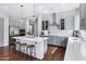 Bright kitchen features quartz countertops, stainless steel appliances, and a large island with barstool seating at 19009 E Reins Rd, Queen Creek, AZ 85142