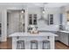 Bright, open kitchen with modern pendant lights and gray cabinets, perfect for cooking and entertaining at 19009 E Reins Rd, Queen Creek, AZ 85142