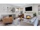 A fireplace provides the focal point to this comfortable living room that also includes a piano at 19009 E Reins Rd, Queen Creek, AZ 85142