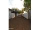 The backyard features desert landscaping and white fencing for privacy at 1922 N 21St Pl, Phoenix, AZ 85006