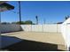 Spacious backyard with a neutral stone landscape and large concrete patio, ideal for outdoor activities and entertaining at 1922 N 21St Pl, Phoenix, AZ 85006