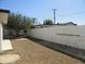 The backyard features gravel and a tall, well maintained fence at 1922 N 21St Pl, Phoenix, AZ 85006