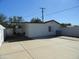 Spacious backyard featuring a covered patio and expansive concrete area, perfect for outdoor activities and entertainment at 1922 N 21St Pl, Phoenix, AZ 85006