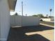 This backyard features a privacy wall, a convenient concrete driveway, and potential street parking at 1922 N 21St Pl, Phoenix, AZ 85006