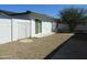 The backyard features a privacy wall, a gate, and gravel at 1922 N 21St Pl, Phoenix, AZ 85006
