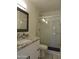 Bathroom featuring a granite countertop vanity and a walk-in shower with glass door at 1922 N 21St Pl, Phoenix, AZ 85006