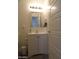 Bathroom features a modern vanity with a framed mirror and decorative lighting at 1922 N 21St Pl, Phoenix, AZ 85006
