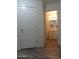 Hallway view into a bathroom featuring a white vanity with storage and warm lighting at 1922 N 21St Pl, Phoenix, AZ 85006