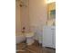 Bathroom featuring a white tiled shower, toilet, and a modern vanity at 1922 N 21St Pl, Phoenix, AZ 85006