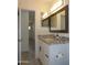 Bathroom boasting a vanity with granite countertop, framed mirror, and modern fixtures at 1922 N 21St Pl, Phoenix, AZ 85006