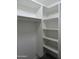 Walk-in closet featuring built-in shelving and ample storage space at 1922 N 21St Pl, Phoenix, AZ 85006