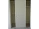 Open closet features a sliding door and shelving for optimal storage at 1922 N 21St Pl, Phoenix, AZ 85006