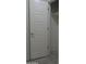 Interior closet with a white door and shelving, providing efficient storage space at 1922 N 21St Pl, Phoenix, AZ 85006