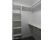 Walk-in closet featuring built-in shelving and ample storage space at 1922 N 21St Pl, Phoenix, AZ 85006