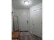The entryway showcases a mirror and a wooden trunk with a view of the front door and a hallway closet at 1922 N 21St Pl, Phoenix, AZ 85006