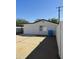 The back of a home with a covered patio area, a concrete patio, and a backyard with a view of the neighborhood at 1922 N 21St Pl, Phoenix, AZ 85006