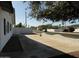 This charming home features a white privacy wall, convenient concrete driveway, and street parking at 1922 N 21St Pl, Phoenix, AZ 85006