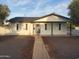 Charming single story home featuring a gray door, gray trim, and a well maintained front yard at 1922 N 21St Pl, Phoenix, AZ 85006