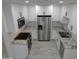 Bright kitchen featuring white cabinets, granite countertops, stainless steel appliances, and tile backsplash at 1922 N 21St Pl, Phoenix, AZ 85006