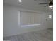 This comfortable living room is filled with natural light and features light, wood-look floors at 1922 N 21St Pl, Phoenix, AZ 85006