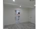 Bright living room features recessed lighting and modern floors, leading into the kitchen area at 1922 N 21St Pl, Phoenix, AZ 85006