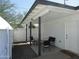 A front porch with outdoor seating and door provides a welcoming spot to relax and enjoy the outdoors at 1922 N 21St Pl, Phoenix, AZ 85006