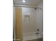 Subway tiled shower and bathtub combo with shower curtain and built in niche at 1922 N 21St Pl, Phoenix, AZ 85006