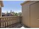Relaxing balcony with wood railings and a door leading to outdoor storage at 200 E Southern Ave # 368, Tempe, AZ 85282