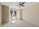 Sunlit bedroom featuring carpet floors and a large window with modern drapes at 200 E Southern Ave # 368, Tempe, AZ 85282