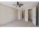 Bright bedroom features carpet floors, a ceiling fan, and two closets at 200 E Southern Ave # 368, Tempe, AZ 85282